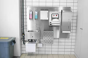 Hygienewand mit Hebeanlage und Spendersystem für Einwegbekleidung 