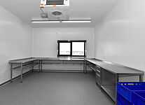 Stainless steel working tables and working cupboards in an fish smoke house fabric