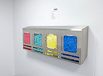 Color-sorted hairnet in stainless steel dispenser