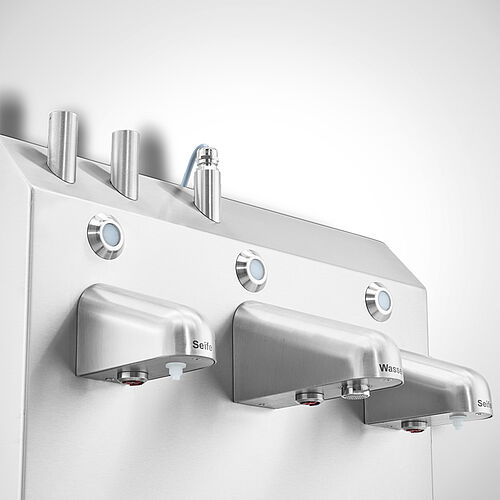 Cleancenter Type HL-CC I with optional media supply on top for power and water: LED-Signal lights directly above the sensor taps