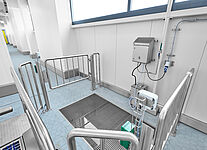 Material sluice within a personal hygiene station with magnetic railing gate solution 