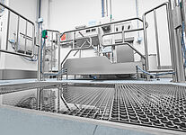 Drive-through disinfection basin within a material sluice (hygiene station) 